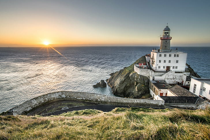 gray and white lighthouse on building near cliff and body of water during sunset, Sunrise, Baily lighthouse, Dublin, gray, white, building, cliff, body of water, sunset, clouds, composition, europe, ireland, konica minolta, landscape, lighthouse, long exposure, motion, photo, photography, sea, seascape, sky, sony a7, travel, ultra, coastline, famous Place, HD wallpaper