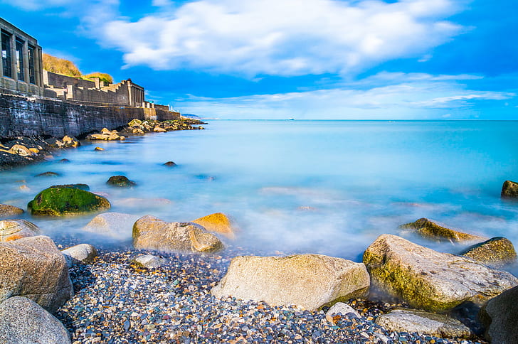 stone on ocean under white cloudy blue sky during daytime, ireland, ireland, Dun Laoghaire, Ireland, stone, ocean, white, cloudy, blue sky, daytime, clouds, colors, europe, exposure, landscape, long, motion, nex, nex6, photo, photography, sea, sel18200le, sony, travel, beach, coastline, rock - Object, summer, nature, outdoors, blue, water, sky, HD wallpaper