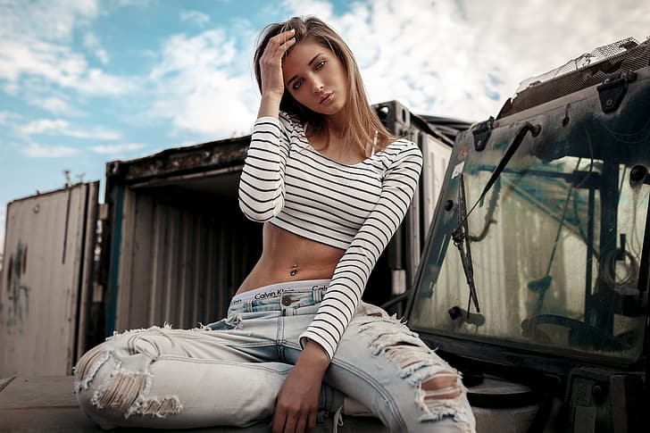 girl, Model, long hair, photo, blue eyes, lips, jeans, face, blonde, piercing, belly, t-shirt, sitting, tummy, portrait, pants, navel, mouth, Calvin Klein, looking at camera, torn jeans, pierced navel, straight hair, looking at viewer, hand in hair, torn pants, bare midriff, HD wallpaper