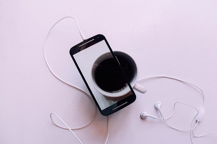 black Android smartphone and white ceramic cup, mobile phone, smartphone, cup, coffee, headphones, HD wallpaper