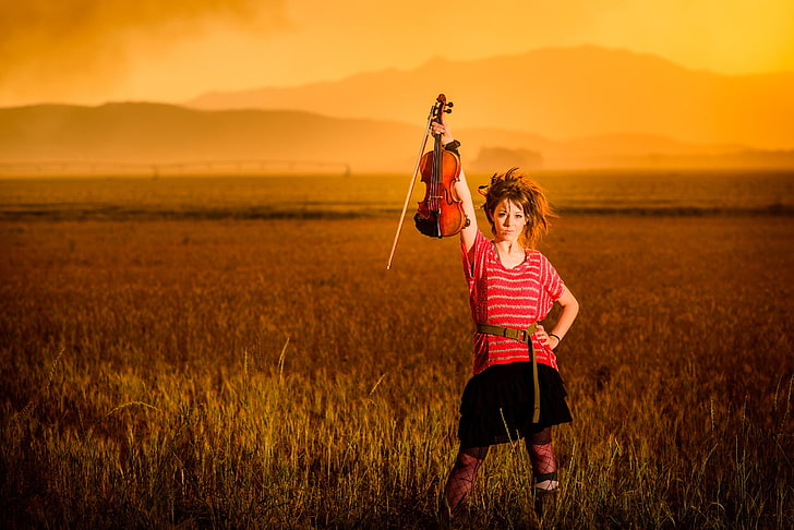 women's red and white shirt, field, sunset, mountains, violin, beauty, Lindsey Stirling, violinist, HD wallpaper