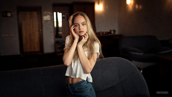 women, Anton Parshunas, blonde, blue eyes, hand on face, white shirt, jeans, denim, couch, looking at viewer, touching face, HD wallpaper
