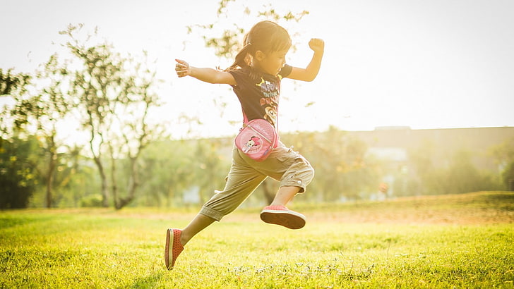 girl jumping on grass, jumping, children, field, sunlight, blurred, pigtails, HD wallpaper