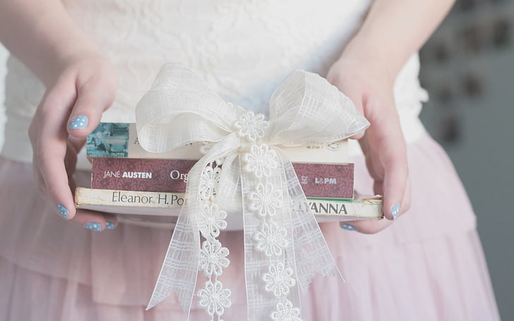 three assorted books and white ribbon, bows, books, hands, tape, HD wallpaper