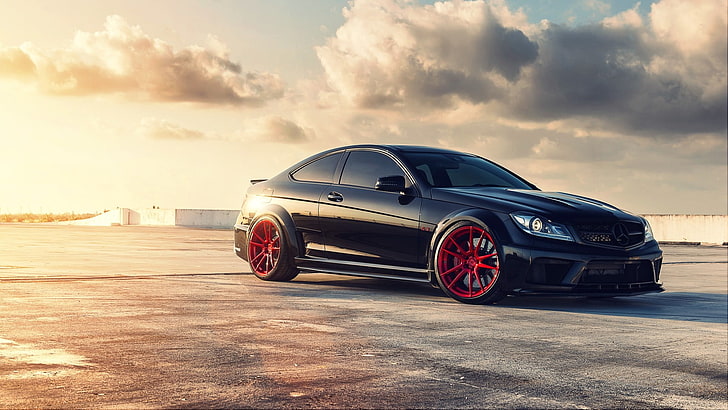 black coupe, black coupe parked on gray pavement, car, Mercedes-Benz, C63 AMG, rims, vehicle, sunlight, bright, asphalt, red, black cars, yellow, HD wallpaper