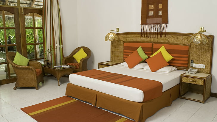 white and brown bedspread beside rattan frame sofa chairs, Vakarufalhi Island Resort, Best Hotels of 2015, tourism, travel, resort, vacation, orange, HD wallpaper
