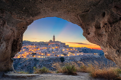 gray concrete buildings, Italy, Matera, cave, rock, town, shrubs, cityscape, city lights, tower, evening, HD wallpaper HD wallpaper