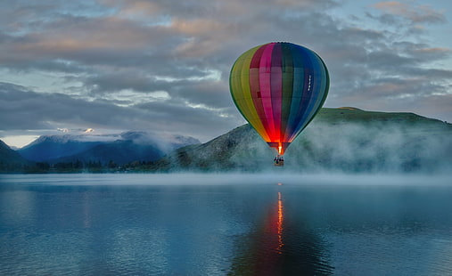 stock photography of multicolored hot air balloon over body of water under cloudy sky, lake hayes, lake hayes, hot Air Balloon, flying, adventure, sky, nature, air Vehicle, travel, outdoors, HD wallpaper HD wallpaper
