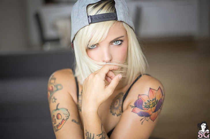 Spicy Suicide, inked girls, bare shoulders, tank top, blonde, looking at viewer, depth of field, portrait, tattoo, gray eyes, bonnet, pierced nose, women, model, bokeh, hair in face, Suicide Girls, indoors, HD wallpaper