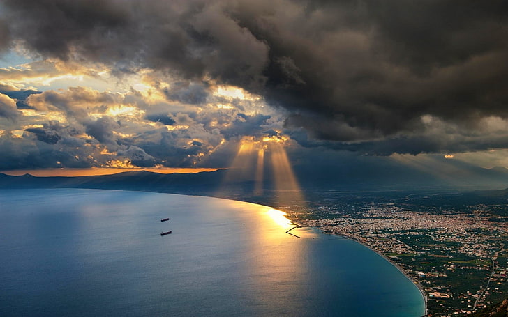 aerial photography of body of water, nature, landscape, sunset, sun rays, cityscape, sea, clouds, bay, sky, water, mountains, HD wallpaper