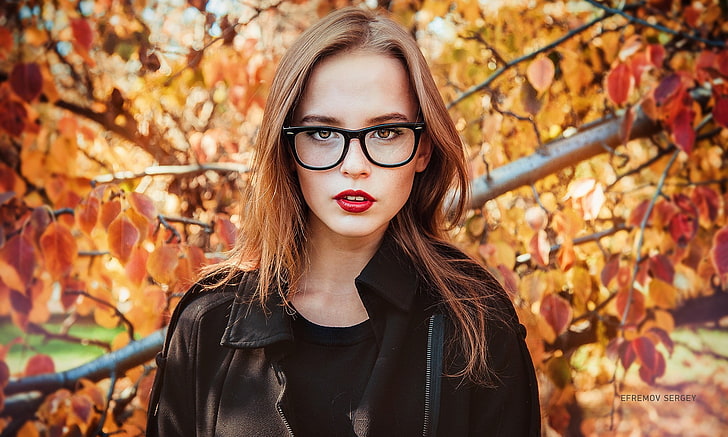 women's black framed Wayfarer-styled eyeglasses, woman wearing black zip-up leather jacket with black framed wayferer eyeglasses, women, portrait, leaves, glasses, women with glasses, red lipstick, sweater, HD wallpaper