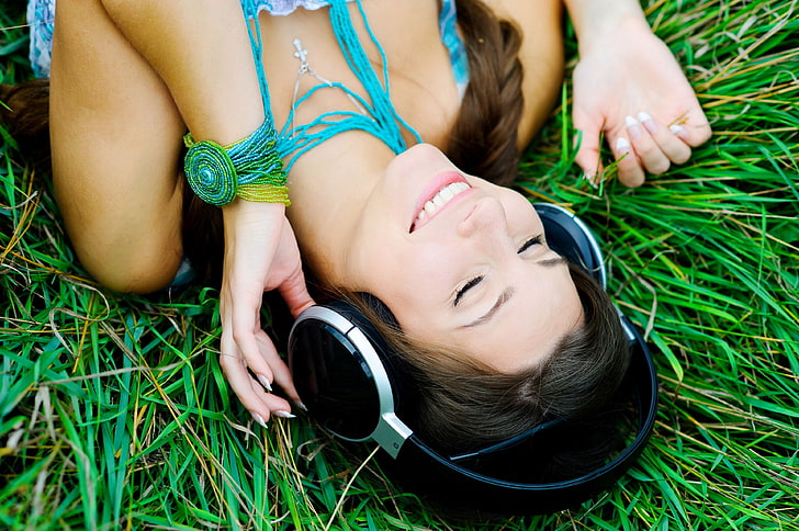 black and gray wireless headphones, greens, grass, girl, nature, smile, music, background, stay, mood, headphones, brunette, widescreen, song, full screen, HD wallpapers, relaxation, HD wallpaper