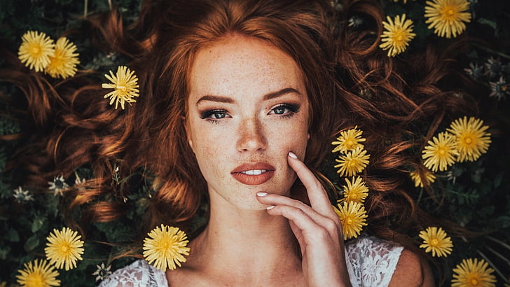 women's white sleeveless top, woman in white top laying on yellow flowers during daytime, face, flowers, dandelion, freckles, lying on back, Riley Rasmussen, women, redhead, long hair, HD wallpaper