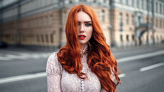 woman's red hair color, women, model, redhead, long hair, women outdoors, looking at viewer, open mouth, blue eyes, red lipstick, street, building, urban, white clothing, windy, Georgy Chernyadyev, hair in face, wavy hair, lace, see-through clothing, HD wallpaper HD wallpaper