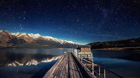 black wooden dock, brown wooden dock under starry night, stars, blue, landscape, reflection, lake, mountains, water, night, nature, horizon, snowy peak, trees, forest, hills, pier, wood, wooden surface, house, mist, shadow, Composite, HD wallpaper HD wallpaper
