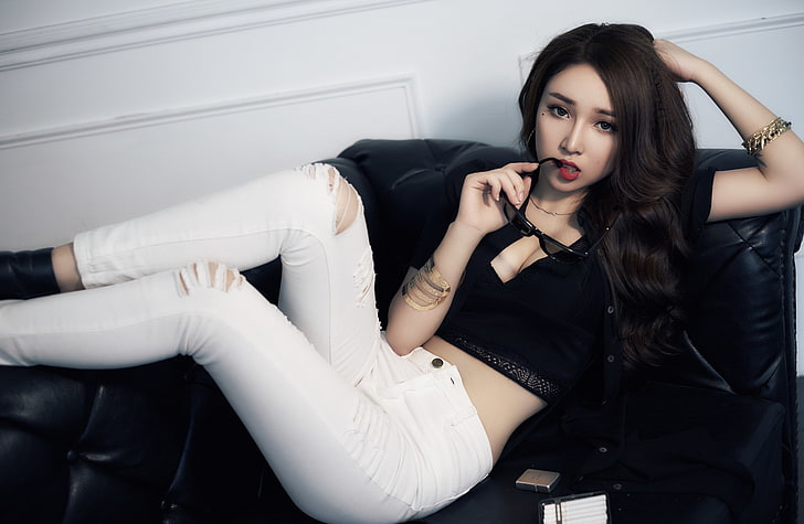 women, model, Asian, looking at viewer, torn jeans, crop top, cleavage, sitting, couch, red lipstick, sunglasses, brunette, long hair, women indoors, white jeans, HD wallpaper