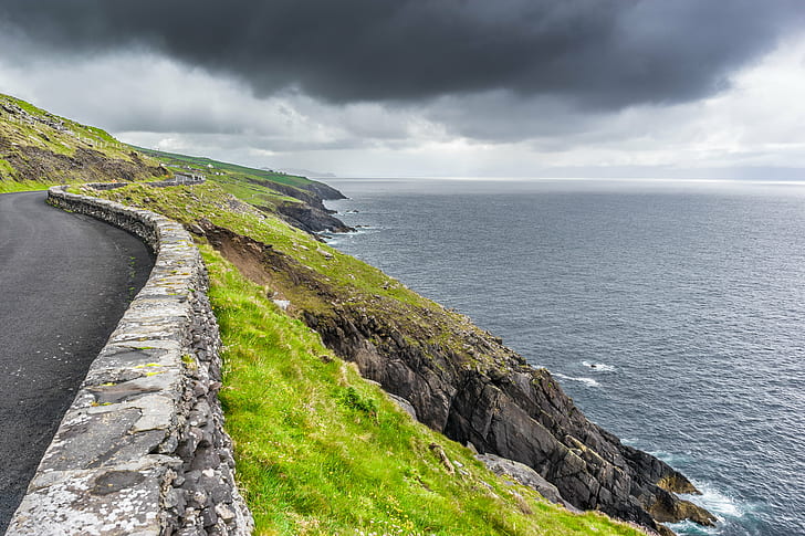 landscape photography of road near cliff, dingle, dunquin, kerry, ireland, dingle, dunquin, kerry, ireland, Dingle, Dunquin, co. Kerry, Ireland, landscape photography, road, cliff, clouds, dark, europe, geotagged, grass, mountains, rocks, sea, sky, sony a7, travel, weather, HD wallpaper
