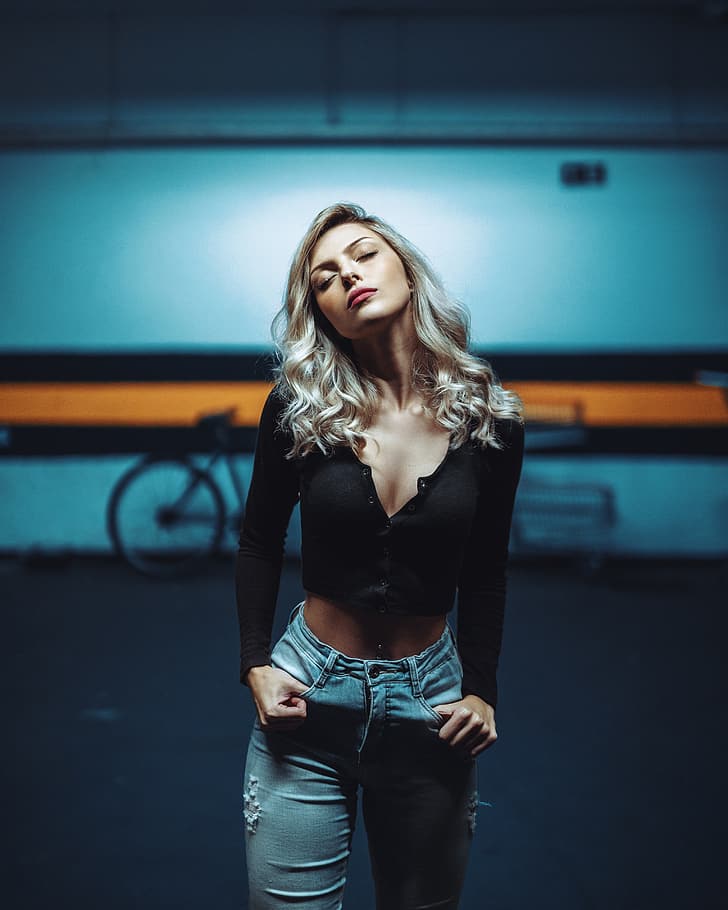 women, model, blonde, portrait display, black tops, cleavage, belly, pierced navel, jeans, torn jeans, frontal view, closed eyes, depth of field, parking, parking lot, bycicle, HD wallpaper