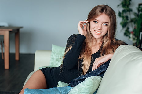 women, model, brunette, looking at viewer, smiling, portrait, indoors, depth of field, sitting, long hair, touching hair, black clothing, couch, cushions, women indoors, happy, holding hair, blue eyes, painted nails, HD wallpaper HD wallpaper