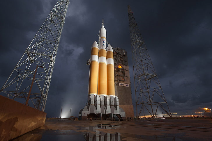 white and orange rocket, landscape, clouds, storm, NASA, spaceship, rocket, Orion, USA, construction site, scaffolding, lights, water, prototypes, reflection, delta heavy, HD wallpaper
