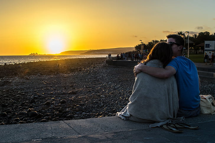 couple holding each other sitting near beach during golden hour, romantic, sunset, couple, beach, golden hour, 35mm, candid, canon fd, europe, gran canaria, mas, palomas, orange, photo, photography, pier, sea, sky, sony a7, spain, sunset  yellow, faceless, street photography, people, outdoors, HD wallpaper