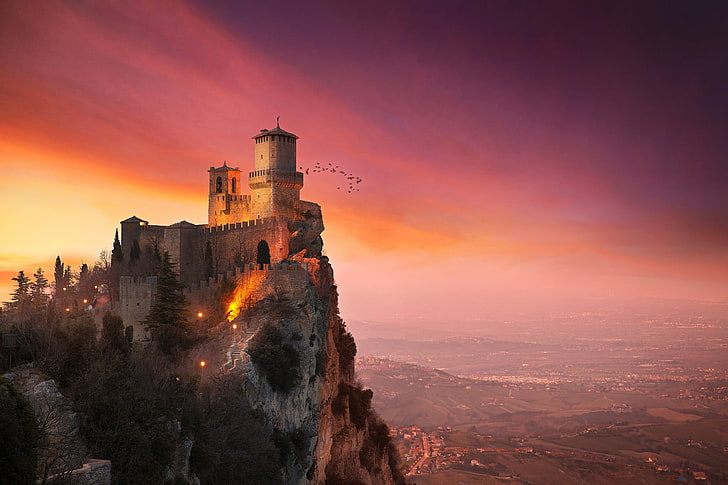 videogame screenshot, architecture, castle, nature, landscape, trees, San Marino, rock, hills, town, tower, sunset, clouds, house, birds, mountains, HD wallpaper