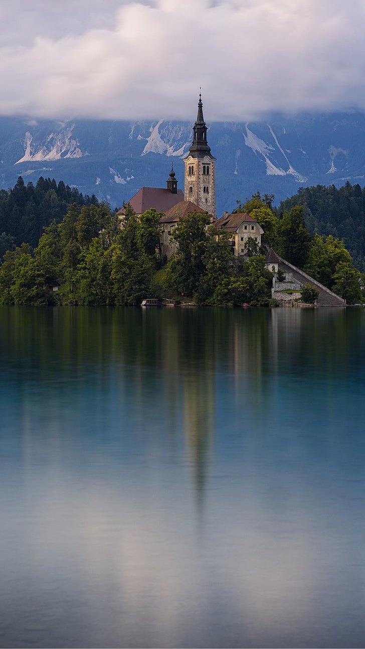 photo of calm body of water beside house during daytime, architecture, building, portrait display, church, Slovenia, mountains, mist, lake, trees, island, reflection, forest, nature, ancient, landscape, HD wallpaper
