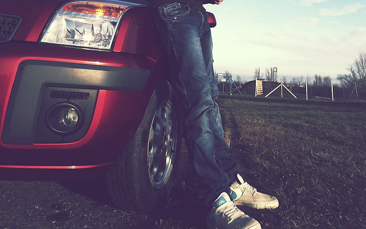 person in blue jeans leaning on red car, Ford, Nike, car, ford fusion, HD wallpaper