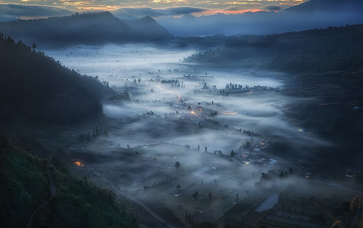 village surround by mountains illustration, aerial photography of fog covered town, cityscape, Indonesia, mist, mountains, clouds, forest, morning, valley, field, blue, nature, landscape, HD wallpaper