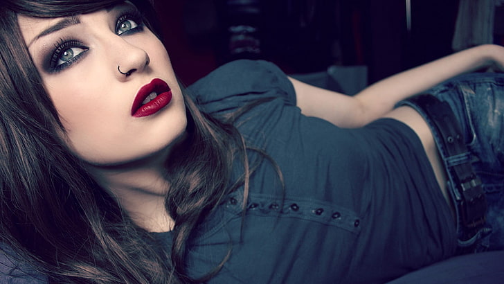 woman in black shirt lying, lying down, blue eyes, brunette, red lipstick, Niky Von Macabre, women, makeup, nose rings, lolina green, HD wallpaper