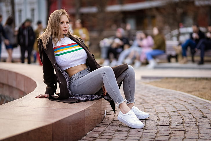 Anna Bykanova, women, model, blonde, long hair, looking away, smiling, crop top, white tops, belly, pierced navel, jeans, coats, sitting, urban, depth of field, outdoors, women outdoors, Ilya Pistoletov, no bra, nipples through clothing, painted nails, red nails, people, brown jacket, HD wallpaper