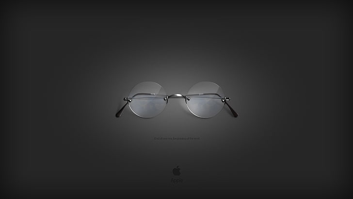 نظارة طبية مستديرة بإطارات فضية اللون من ستيف جوبز ونظارات واقية رمادية وتفاح، خلفية HD