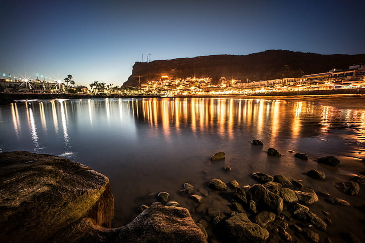 black rocks on body of water near city lights under blue sky during sunset, gran canaria, canary islands, gran canaria, canary islands, Puerto de Mogan, Mogan, Gran Canaria, Canary Islands, black rocks, body of water, city lights, blue sky, sunset, beach, europe, gran canaria, landscape, long exposure, mogan, photo, photography, puerto, rocks, sea, sky, sony a7, travel, voigtlander, night, dusk, HD wallpaper