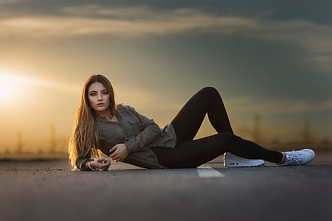  the sky, look, the sun, sunset, pose, model, portrait, makeup, figure, hairstyle, lies, shirt, brown hair, beauty, sneakers, pants, bokeh, on the pavement, HD wallpaper HD wallpaper