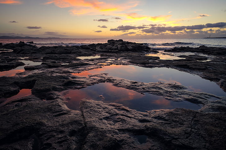 rock formation and body of water at daytime, rock formation, body of water, daytime, horizon, puddle, purple, lava, canary islands, orange, clouds, sun, backlit, long, time exposure, puddles, reflection, backlight, magenta, atlantic ocean, Lanzarote, yellow, spain, sea, Playa Blanca, Canarias, ES, sunset, nature, beach, coastline, dusk, landscape, water, outdoors, summer, HD wallpaper