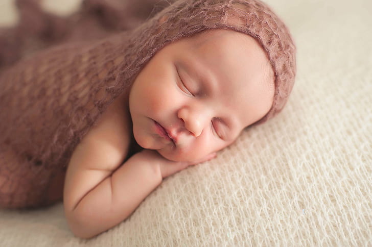 baby in brown knitted textile sleeping laying on white textile, baby, child, cute, small, newborn, sleeping, blanket, childhood, lying Down, people, innocence, human Face, napping, one Person, caucasian Ethnicity, HD wallpaper