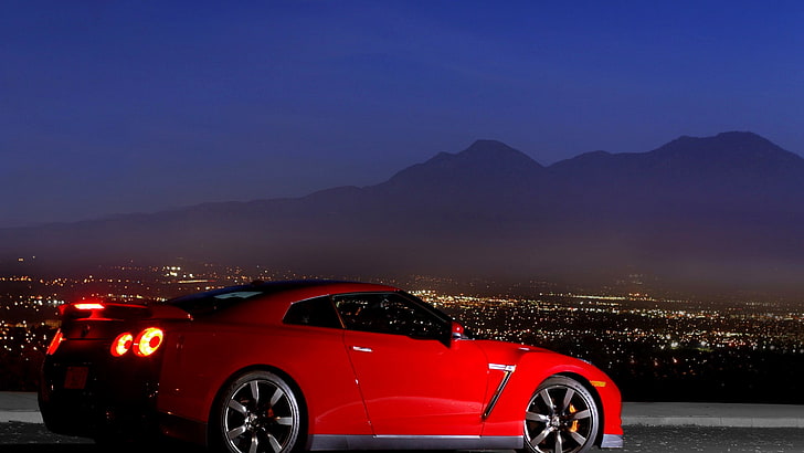 red coupe, Nissan, Nissan GT-R, night, car, red cars, lights, mountains, Nissan GTR, road, city, vehicle, HD wallpaper