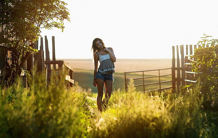 women, jean shorts, grass, sunlight, fence, Michelle Lit, HD wallpaper