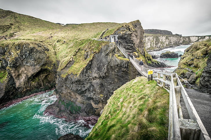 panoramic photography of bridge and hills during daytime, Carrick-a-rede, Northern Ireland, panoramic photography, bridge, hills, daytime, cliff, clouds, cloudy, europe, konica minolta, landscape, leading  line, path, photo, photography, rocks, sea, seascape, sky, sony a7, travel, uk, ultra, united kingdom, view, wideangle, Ballintoy, nature, scenics, outdoors, coastline, HD wallpaper