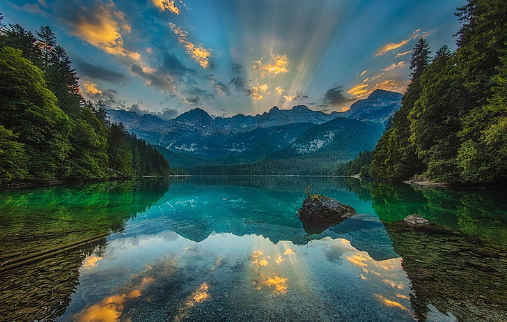 lanscape photo of lake surrounded by trees, photography, nature, landscape, lake, calm waters, sunset, reflection, sun rays, forest, mountains, Dolomites (mountains), Italy, HD wallpaper